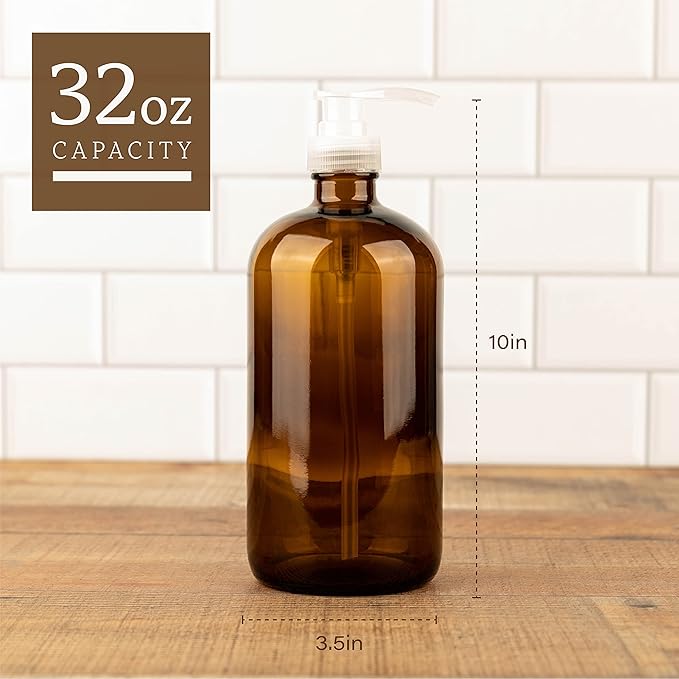 Kitchentoolz 32 Ounce Large Glass Pump Bottles - Refillable Dispenser for Laundry Detergent, Lotion, Soap, Shampoo, Oils. Amber Bottles with Natural Color Pumps - Pack of 4